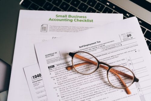 tax forms and glasses